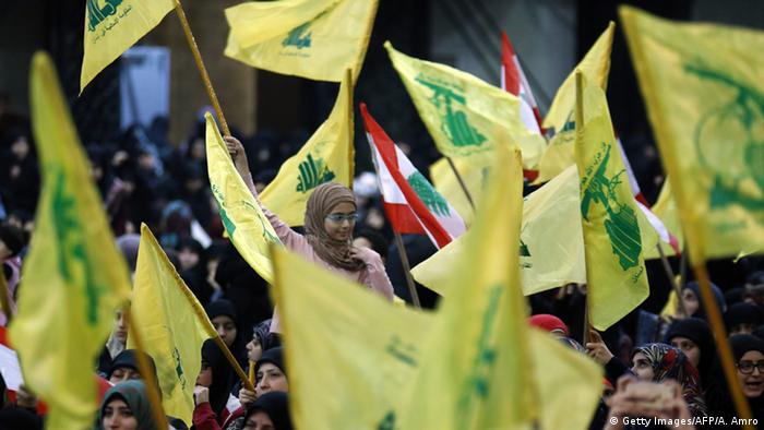 Supporters waving Hezbollah flags in Lebanon