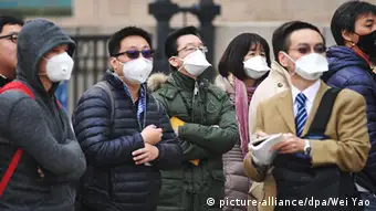 China Peking Journalisten tragen Masken