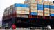 China Qingdao Hafen Schiff mit Containern davor LKW China Qingdao Hafen Schiff mit Containern davor LKW