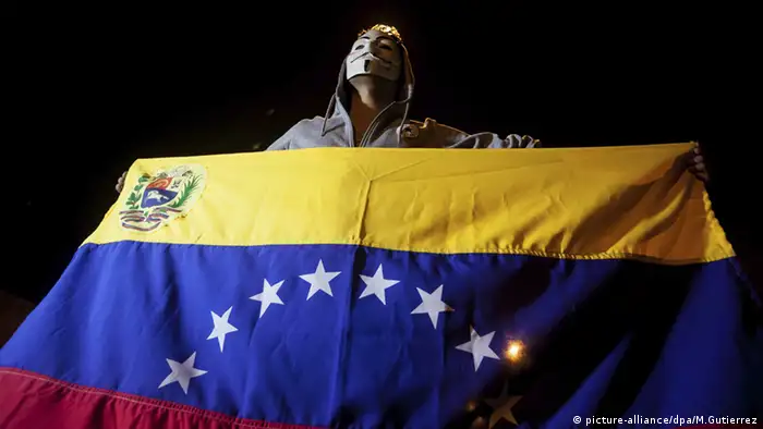 Venezuela flag and protestor
