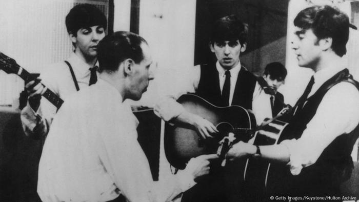 Beatles with producer George Martin in studio