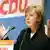 German Chancellor Angela Merkel gestures as she speaks at a CDU congress