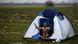 A migrant, who is waiting to cross the Greek-Macedonian border, reacts while being photographed at a makeshift camp near the village of Idomeni, Greece March 9, 2016. A migrant, who is waiting to cross the Greek-Macedonian border, reacts while being photographed at a makeshift camp near the village of Idomeni, Greece March 9, 2016.