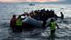 Refugees arrive in a boat on the Greek Island of Lesbos Refugees arrive in a boat on the Greek Island of Lesbos