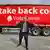Former London Mayor Boris Johnson gives a double 'thumbs-up' in front of a large, red, tractor-trailor emblazoned with the slogan, "Let's take back control"