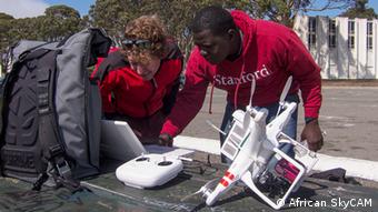 Men prepare a drone for flight