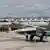 Russian warplanes and military personnel at the the Syrian Hmeymim airbase
