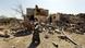 A child walks past her family's house that was destroyed by a Saudi-led airstrike A child walks past her family's house that was destroyed by a Saudi-led airstrike