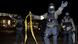 Polizisten mit Sturmgewehren stehen vor dem geschlossenen Stadion und Sperren den Bereich ab. Nach den Terroranschlägen von Paris wurde das Spiel kurzfristig abgesagt, das bereits geöffnete Stadion wurde evakuiert. Foto: Julian Stratenschulte/dpa +++(c) dpa - Bildfunk+++ Polizisten mit Sturmgewehren stehen vor dem geschlossenen Stadion und Sperren den Bereich ab. Nach den Terroranschlägen von Paris wurde das Spiel kurzfristig abgesagt, das bereits geöffnete Stadion wurde evakuiert. Foto: Julian Stratenschulte/dpa +++(c) dpa - Bildfunk+++