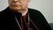 Cardinal Angelo Scola of Milan poses in full religious dress, including a large cross dangling from his neck. Cardinal Angelo Scola of Milan poses in full religious dress, including a large cross dangling from his neck.
