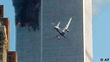 A jet airliner is lined up on one of the World Trade Center towers in New York Tuesday, Sept. 11, 2001. In the most devastating terrorist onslaughts ever waged against the United States, knife-wielding hijackers crashed two airliners into the World Trade Center on Tuesday, toppling its twin 110-story towers. (AP Photo/Carmen Taylor)