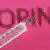 Символическая картинка: шприц с препаратом на фоне слова Doping