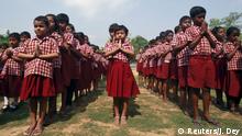 11.04.2016 School children pray for the victims of a fire at a temple in the southern state of Kerala in the lawns of their school in Agartala, India, April 11, 2016. REUTERS/Jayanta Dey Copyright: Reuters/J. Dey