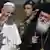 Papa Francis akilakiwa na Askofu Mkuu Ieronimos wa Kanisa la Orthodox nchini Ugirikli baada ya kuwasili kisiwa cha Lesbos (16.04.2016)