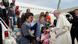 Pope Francis (R) welcomes a group of Syrian refugees that flew with him after landing at Ciampino airport in Rome, Italy Copyright: picture-alliance/dpa/F. Monteforte Pope Francis (R) welcomes a group of Syrian refugees that flew with him after landing at Ciampino airport in Rome, Italy Copyright: picture-alliance/dpa/F. Monteforte