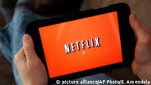 FILE - In this Friday, Jan. 17, 2014, file photo, a person displays Netflix on a tablet in North Andover, Mass. Amazon is taking on Netflix and Hulu with a stand-alone video streaming service. Starting the week of April 18, 2016, customers can pay $8.99 a month to watch Amazon¿s Prime video streaming service. Previously, the only way to watch Prime videos was to pay $99 a year for Prime membership, which includes free two-day shipping on items sold by the site. The video-only option won¿t come with any free shipping perks. (AP Photo/Elise Amendola, File) Copyright: picture alliance/AP Photo/E. Amendola