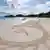 Sandman is creating art in the sand at a beach (Photo: NDR)