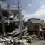 Rescue team members and policemen search for victims at a collapsed hotel (L) after an earthquake struck off the Pacific coast in Pedernales, Ecuador, April 19