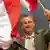 Austrian far right Freedom Party (FPOe) presidential candidate Norbert Hofer waves with Austrian flags during the final election rally in Vienna, Austria, April 22, 2016 (Photo: REUTERS/Leonhard Foeger)
