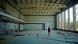 Tour guide Vita Polyakova stands in a derelict sports hall in Pripyat Tour guide Vita Polyakova stands in a derelict sports hall in Pripyat