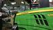 Трактор John Deere на ярмарке в Ганновере, фото из архива Трактор John Deere на ярмарке в Ганновере, фото из архива