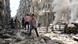 People walk amid the rubble of destroyed buildings following a reported air strike on the rebel-held neighbourhood of al-Kalasa in the northern Syrian city of Aleppo, on April 28, 2016 (Photo: AMEER ALHALBI/AFP/Getty Images) People walk amid the rubble of destroyed buildings following a reported air strike on the rebel-held neighbourhood of al-Kalasa in the northern Syrian city of Aleppo, on April 28, 2016 (Photo: AMEER ALHALBI/AFP/Getty Images)