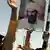 A placard with Osama bin Laden's image amid a protest in Pakistan