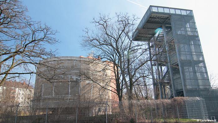 A cylindrical concrete structure at a residential area in Berlin.