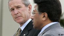 U.S. President George W. Bush, left, looks towards Pakistani President Gen. Pervez Musharraf as they participate in a joint press availability at Aiwan-e-Sadr, or house of the President, in Islamabad, Pakistan, Saturday, March 4, 2006. President Bush showed solidarity Saturday with Pakistani President Gen. Pervez Musharraf's war-on-terror alliance with the United States, a stance at odds with many in this Islamic nation. (AP Photo/Charles Dharapak)
