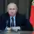 Russian President Vladimir Putin chairs a meeting with military officials