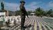 A handout picture released by the Colombian Police shows a Colombian Police officer standing guard in front of a display of confiscated packages of cocaine in Turbo, Colombia, 15 May 2016 (c) Colombian Police A handout picture released by the Colombian Police shows a Colombian Police officer standing guard in front of a display of confiscated packages of cocaine in Turbo, Colombia, 15 May 2016 (c) Colombian Police