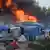 Brennende Hütten im Lager von Calais (Foto: dpa)