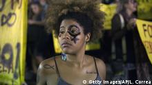 A woman wearing a female gender symbol attends a protest against the gang rape of a 16-year-old girl in Rio de Janeiro, Brazil, Friday, May 27, 2016. The assault last Saturday came to light after several men joked about the attack online, posting graphic photos and videos of the unconscious, naked teen on Twitter. (AP Photo/Leo Correa) |