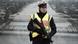 An armed German police officer stands in front of a poster with a picture of the river Rhine An armed German police officer stands in front of a poster with a picture of the river Rhine