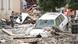 A car and twisted trees are stuck in mud following floods in Simbach am Inn, Germany. A car and twisted trees are stuck in mud following floods in Simbach am Inn, Germany.