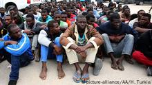 TRIPOLI, LIBYA - OCTOBER 21: African origin migrant who tried to go to European countries illegally are seen after being caught in Tripoli, Libya on October 21, 2015. 130 illegal migrants were brought to a shelter in Tripoli. +++ (C) picture-alliance/AA/H. Turkia