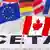 Флаги Канады, Евросоюза и стран ЕС на фоне надписи CETA
