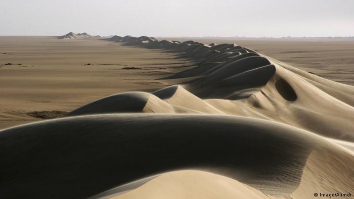 A Sand dune belt and sunrise in the Erg of Bilma in the Ténéré desert region of the Sahara