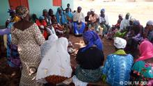 Focus Group: Women sit at a focused group discussion and listening to a domestic violence officers. They says it is against the norm to report a husband. © DW/M.Suuk