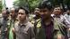 Bangladesh police escort Islamist militant Suman Hossain Patowari (center), 20, after his arrest in connection with an attack on publisher Ahmedur Rashid Tutul in DhakaBangladesch Festnahmen nach Razzien in Dhaka Bangladesh police escort Islamist militant Suman Hossain Patowari (center), 20, after his arrest in connection with an attack on publisher Ahmedur Rashid Tutul in DhakaBangladesch Festnahmen nach Razzien in Dhaka