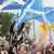 Supporters of Scottish independence wave flags at a rally in Edinburgh