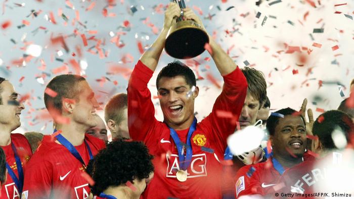 Manchester United captain Cristiano Ronaldo holds the trophy after their victory against Liga de Quito of Ecuador in the final of the FIFA Club World Cup 2008