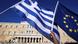 People wave Greek and EU flags outside the Greek parliament in Athens People wave Greek and EU flags outside the Greek parliament in Athens