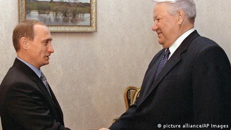 Boris Yeltsin shakes hands with Prime Minister Vladimir Putin