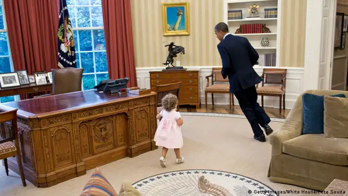 Pete Souza image of Barack Obama running with a little girl in the Oval Office (Getty Images/White House/Pete Souza)