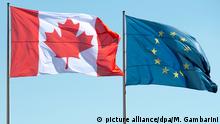 13.5.2016*** ARCHIV - Die Flaggen Kanadas (l) und der Europäischen Union wehen am 27.03.2014 in Berlin. Foto: Maurizio Gambarini/dpa (zu dpa Merkel will Bundestag in Ceta-Prozess einbinden vom 29.06.2016) +++(c) dpa - Bildfunk+++ | Verwendung weltweit picture alliance/dpa/M. Gambarini