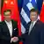 Премьер-министр Греции Алексис Ципрас жмет руку председателю КНР Си Цзиньпину