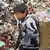 China Kind von Migranten auf Müllhalde in Guiyang