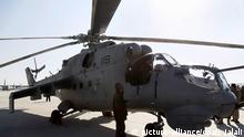 20. Januar 2016 epa05113572 An Afghan soldier stands beside one of the four Russian-made Mi-25 helicopters inducted in Afghan Air Force, in Kabul, Afghanistan, 20 January 2016. Afghanistan on 20 January acquired four Russian-made Mi-25 helicopters from India to strengthen their military capabilities. EPA/JAWAD JALALI +++(c) dpa - Bildfunk+++ | Copyright: picture-alliance/dpa/J. Jalali