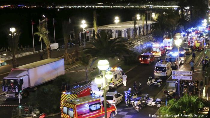 The scene of the attack in Nice with police cars and ambulances